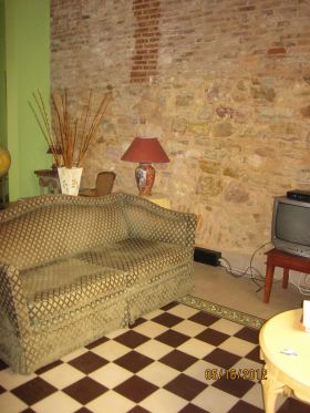 Casco Viejo apartment interior, showing stone wall – Best Places In The World To Retire – International Living